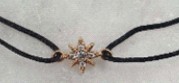 ALOE - Bracelet cordon avec étoile en plaqué or et 5 OZ - BR667022